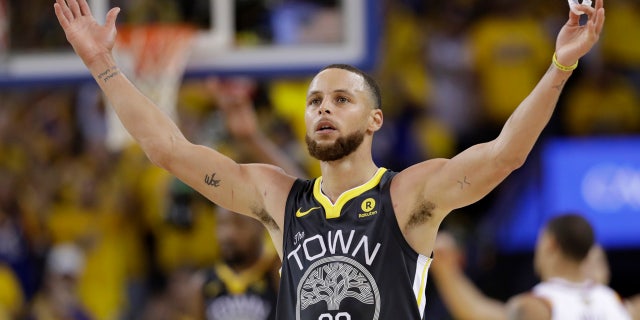 June 3: Golden State Warriors guard Stephen Curry (30) celebrates during the second half of Game 2.