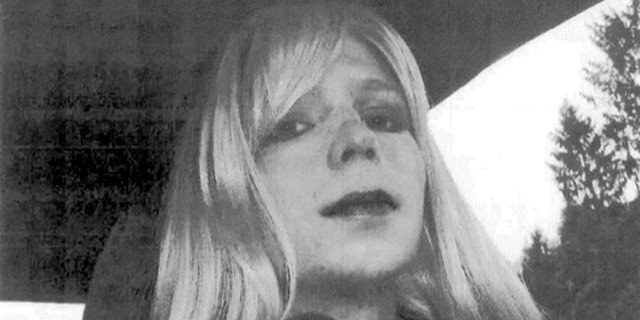 In this undated file photo provided by the U.S. Army, Pfc. Bradley Manning, now known as Chelsea Elizabeth Manning, poses for a photo wearing a wig and lipstick.