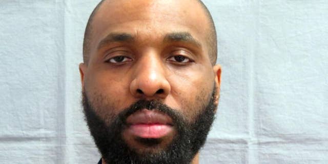 In this photo taken on March 30, 2013 provided by the Michigan Department of Corrections, Nosakhare Onumonu appears in a booking mug. A unique glove and a DNA match helped lead to a conviction in the 1999 slaying of an 84-year-old woman whose body was found in an alley behind a church on Detroit's west side, authorities said. A report in the Detroit Free Press details the case that led to Onumonu being convicted of first-degree murder and felony murder. The 38-year-old man is scheduled to be sentenced Friday, Aug. 21, 2015, to the mandatory term of life in prison without the possibility of parole. (Michigan Department of Correction via AP)