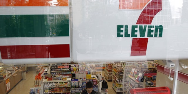 A customer is seen at a Seven-Eleven convenience store in Tokyo December 22, 2010.