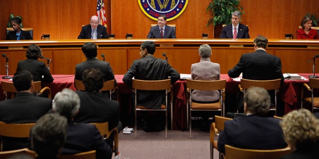 WASHINGTON, DC - DECEMBER 21: Federal Communications Commission Commissioners (L-R) Mignon Clyburn, Michael Copps, Chairman Julius Genachowski, Robert McDowell and Meredith Attwell Baker deliver opening remarks before they voted 3-2 to adopted controversial Net neutrality rules December 21, 2010 in Washington, DC. The rules put into effect by the commission create two different classes of broadband internet service -- one for fixed networks and another for wireless networks -- due to their technological differences. (Photo by Chip Somodevilla/Getty Images) *** Local Caption *** Mignon Clyburn;Michael Copps;Robert McDowell;Julius Genachowski;Meredith Attwell Baker