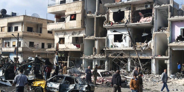 Two blasts in the central Syrian city of Homs killed more than a dozen people and injured many others.