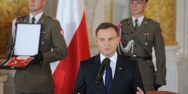 Poland's new President Andrzej Duda speaks during his inauguration ceremony at the Royal Castle in Warsaw, Poland, Thursday, Aug. 6, 2015. (AP Photo/Alik Keplicz)