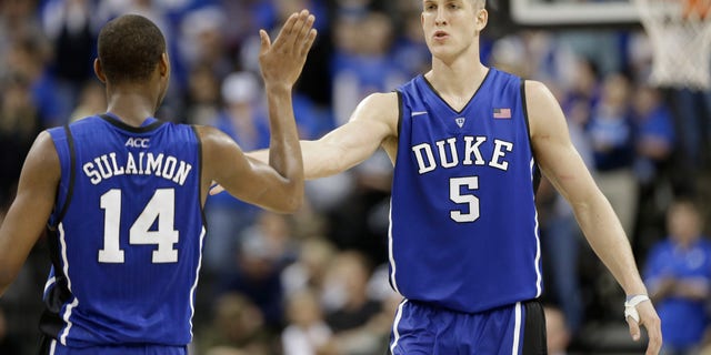 Duke's Mason Plumlee (5) is congratulated by teammate Rasheed Sulaimon (14) during the second half of an NCAA college basketball game against Wake Forest in Winston-Salem, N.C., Wednesday, Jan. 30, 2013. Duke won 75-70. (AP Photo/Chuck Burton)