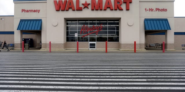 FILE - This July 12, 2013, file photo, shows a Wal-Mart, in Bristol, Pa. Wal-Mart Stores Inc. reports quarterly financial results on Thursday, Nov. 14, 2013. (AP Photo/Matt Rourke, File)