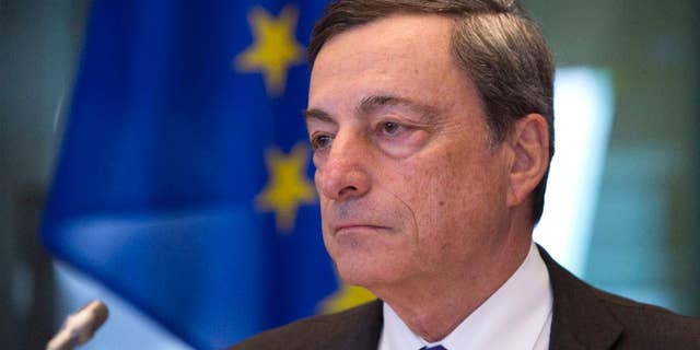 FILE - In this Monday, Sept. 26, 2016 file photo, Governor of the European Central Bank Mario Draghi pauses during a session of the Economic and Monetary Affairs Committee at the European Parliament in Brussels. Investors will sift European Central Bank head Mario Draghi’s remarks on Thursday, Oct. 20. 2016 for clues about a possible extension of its 1.74 trillion euro ($1.91 trillion) bond-buying stimulus program. (AP Photo/Virginia Mayo, File)