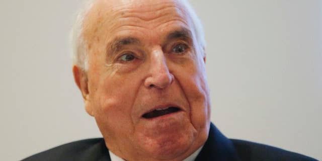 FILE - In this Nov. 3, 2014 file photo former German Chancellor Helmut Kohl talks as he presents his new book "Out of Concern for Europe" in Frankfurt, Germany. (AP Photo/Michael Probst)