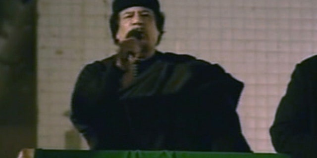 March 22: This image taken from Libyan State TV shows Libyan leader Muammar al-Qaddafi as he talks to a large crowd in Bab El Azizia, Libya.