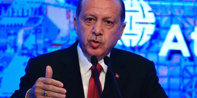 Turkey's President Recep Tayyip Erdogan, gestures as he delivers a speech at an Atlantic Council event in Istanbul, Friday, April 28, 2017. (AP Photo/Lefteris Pitarakis)
