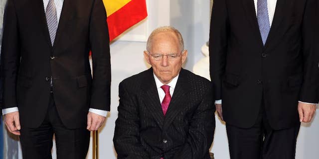 German Finance Minister Wolfgang Schaeuble, center, attends a New Year's reception of German President Joachim Gauck at the Bellevue palace in Berlin, Germany, Tuesday, Jan. 10, 2017. (AP Photo/Michael Sohn)