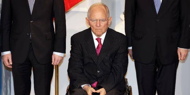 German Finance Minister Wolfgang Schaeuble, center, attends a New Year's reception of German President Joachim Gauck at the Bellevue palace in Berlin, Germany, Tuesday, Jan. 10, 2017. (AP Photo/Michael Sohn)