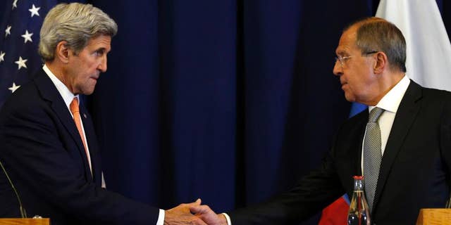 FILE - In this Sept. 9, 2016 file photo, Secretary of State John Kerry, left, and Russian Foreign Minister Sergei Lavrov shakes hands at the conclusion of a news conference following their meeting to discuss the crisis in Syria, in Geneva, Switzerland. The U.S. military will have to shift surveillance aircraft from other regions and increase the number of intelligence analysts to coordinate attacks with Russia under the Syria cease-fire deal partly in order to target militants the U.S. has largely spared, senior officials say. (Kevin Lamarque/Pool Photo via AP, File)