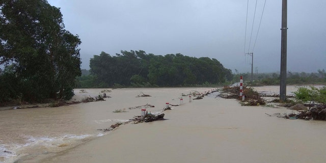 This photo taken on Saturday Nov. 4, 2017, shows a flooded road in central province of Binh Dinh, Vietnam following Typhoon Damrey hit the area.