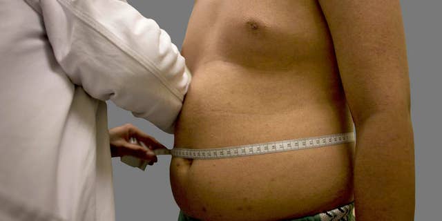 ** ADVANCE FOR SUNDAY, SEPT. 28 ** Angel Moreno, 14, who weighs 71.5 kg, or 156.528 lb, gets a check-up at Mexico's Children's Hospital in Mexico City, Friday, Aug. 29, 2008. Mexico is on track to surpass the United States as one of the world's fattest countries by 2018. Nearly half of Mexico's 110 million people already are overweight, while the number of fat children has climbed 8 percent a year in the last decade. (AP Photo/Alexandre Meneghini)