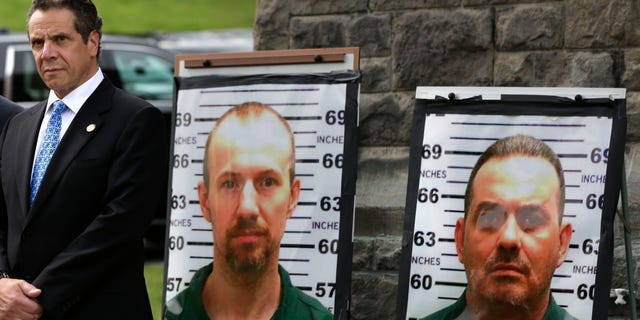 Vermont Governor Peter Shumlin, left, and New York Governor Andrew Cuomo listen during a news conference in front of the Clinton Correctional Facility in Dannemora, N.Y., Wednesday, June 10, 2015. Police were resuming house-to-house searches near the maximum-security prison in northern New York where David Sweat and Richard Matt, two killers escaped using power tools, authorities said Wednesday as they renewed their plea for help from the public. (AP Photo/Seth Wenig)