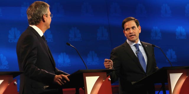 BOULDER, CO - OCTOBER 28:  Presidential candidates Sen. Marco Rubio (R) (R-FL) speaks while Jeb Bush looks on during the CNBC Republican Presidential Debate at University of Colorados Coors Events Center October 28, 2015 in Boulder, Colorado.  Fourteen Republican presidential candidates are participating in the third set of Republican presidential debates.  (Photo by Justin Sullivan/Getty Images)
