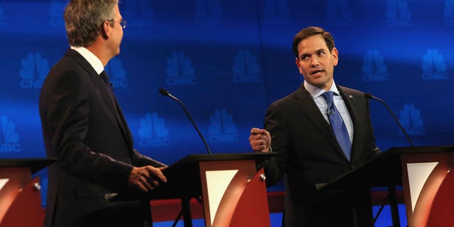 BOULDER, CO - OCTOBER 28: Presidential candidates Sen. Marco Rubio (R) (R-FL) speaks while Jeb Bush looks on during the CNBC Republican Presidential Debate at University of Colorados Coors Events Center October 28, 2015 in Boulder, Colorado. Fourteen Republican presidential candidates are participating in the third set of Republican presidential debates. (Photo by Justin Sullivan/Getty Images)