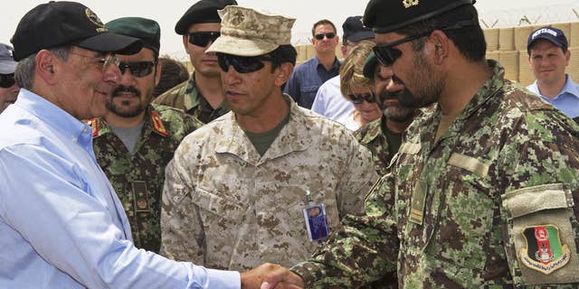 July 10: US Secretary of Defense Leon Panetta greets an Afghan military leader as he makes an unannounced visit to Camp Dwyer, in southern Afghanistan.