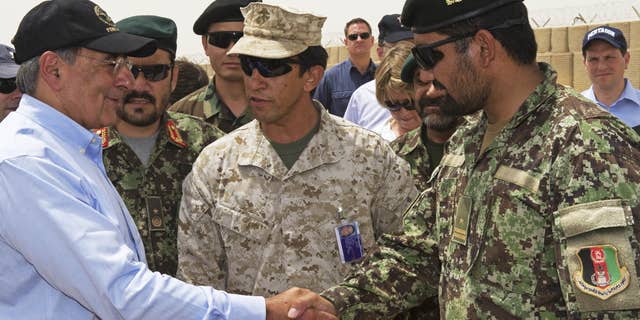 July 10: US Secretary of Defense Leon Panetta greets an Afghan military leader as he makes an unannounced visit to Camp Dwyer, in southern Afghanistan.