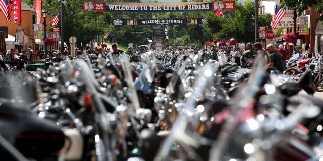 The city streets of Sturgis are lined with motorcycles days before the official kickoff of the annual Sturgis Motorcycle Rally in Sturgis, S.D on Aug 1, 2014. (AP Photo/Toby Brusseau, File)