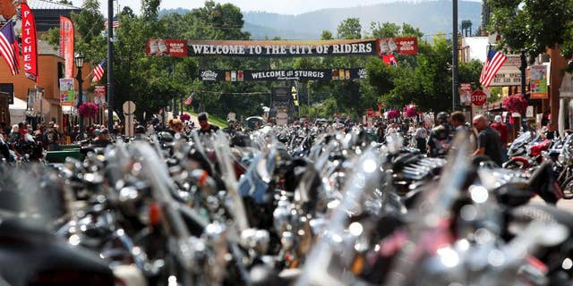 FILE - In this Aug. 1, 2014 file photo, the city streets of Sturgis are lined with motorcycles days before the official kickoff of the annual Sturgis Motorcycle Rally in Sturgis, S.D. Preparations are under way for the landmark 75th anniversary rally beginning Monday, Aug. 3, 2015, where organizers are planning for up to one million people. (AP Photo/Toby Brusseau, File)