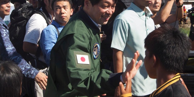 Japanese Defense Minister Itsunori Onodera is seen in the Philippines, Dec. 8, 2013, during his previous stint in the job.
