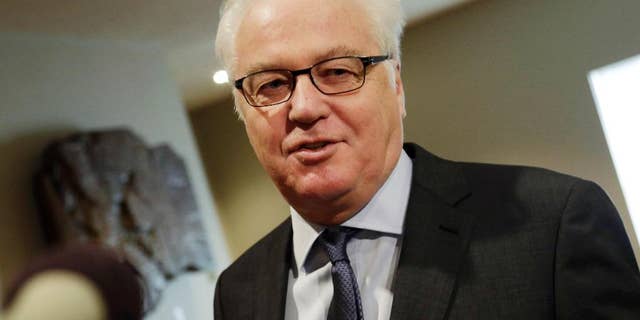 FILE- In this Feb. 7, 2016, file photo, Russia's United Nations Ambassador Vitaly Churkin makes comments to the media prior to a Security Council meeting at U.N. headquarters. Churkin told reporters Wednesday, April 27, that the two hardline Islamic groups — Jaish al-Islam, or the Army of Islam, and Ahrar al-Sham — aren't observing the cessation of hostilities in Syria "and are engaged in terrorist activities" and therefore should be subject to sanctions. (AP Photo/Mark Lennihan, File)