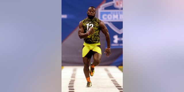FILE - In this Feb. 26, 2013 file photo, Florida defensive back Matt Elam runs a drill during the NFL football scouting combine in Indianapolis. Baltimore Ravens general manager and executive vice president Ozzie Newsome hopes to fill out the team's roster this weekend by making the most of 12 draft picks. There’s a good chance the Ravens could select Elam. It’s even more difficult to guess what will occur in the later rounds. (AP Photo/Dave Martin)
