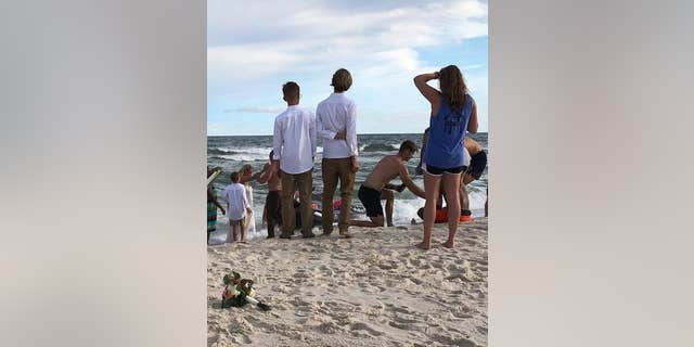When they heard someone in the ocean needed help, Zac jumped into action. He took off his shirt and ran for the water.