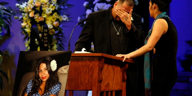 Reynaldo Gonzalez breaks down while remembering his daughter Nohemi Gonzalez, Paris attack victim, at her funeral at the Calvary Chapel in Downey, Calif., Friday, Dec. 4, 2015.  Gonzalez was the 23 year-old Cal State Long Beach student who was killed while dining with friends at a bistro in Paris last month.  (Genaro Molina/Los Angeles Times via AP, Pool)