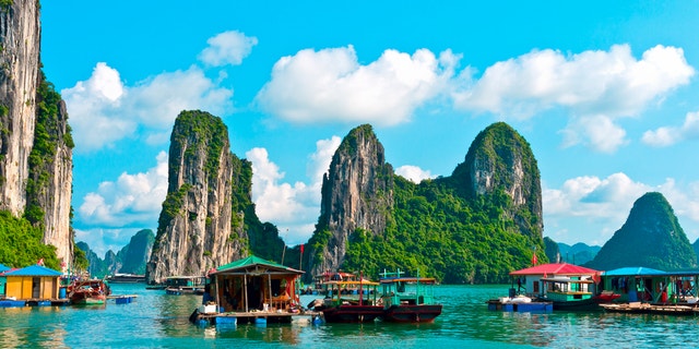Floating village and rock islands in Halong Bay, Vietnam, Southeast Asia