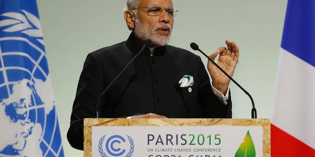 FILE- In this Nov. 30, 2015 file photo, India's Prime Minister Narendra Modi addresses world leaders at the COP21, United Nations Climate Change Conference, in Le Bourget, outside Paris. India's leader says his country will ratify the Paris Agreement on climate change early next month. Modi said Sunday that his government will ratify the agreement Oct. 2, coinciding with the birth anniversary of India's independence leader Mohandas Gandhi. (AP Photo/Michel Euler, File)