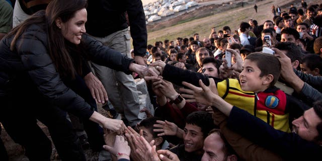 Angelina Jolie meets members of the Yazidi minority in Khanke IDP Camp on January 25, 2015 in Khanke, Iraq.