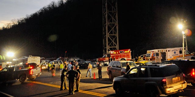 Apr. 4:  West Virginia State Police direct traffic at the entrance to Massey Energy's Upper Big Branch Coal Mine in Montcoal.