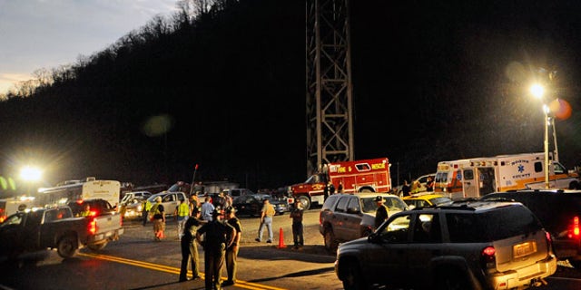 Apr. 4: West Virginia State Police direct traffic at the entrance to Massey Energy's Upper Big Branch Coal Mine in Montcoal.