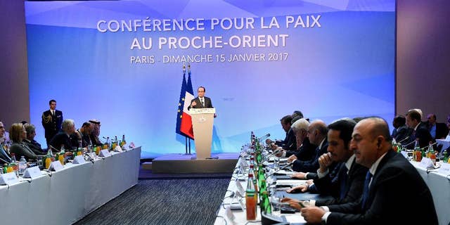 French President Francois Hollande delivers his speech at the opening of the Mideast peace conference in Paris, Sunday, Jan. 15, 2017. Fearing a new eruption of violence in the Middle East, more than 70 world diplomats gathered in Paris on Sunday to push for renewed peace talks that would lead to a Palestinian state. (Bertrand Guay/Pool Photo via AP)