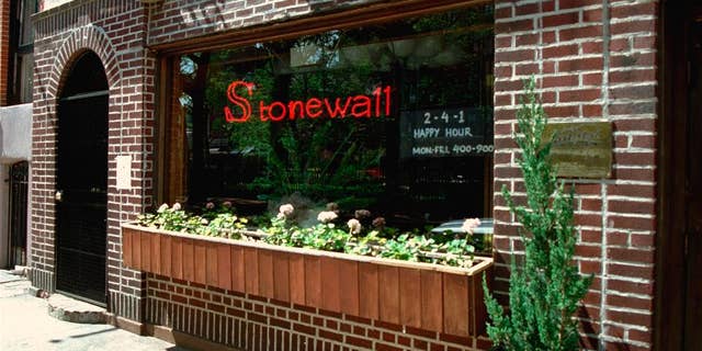 FILE - This May 1994 file photo shows an exterior view of the Stonewall Inn in the Greenwich Village section of New York, site of the 1969 riot that sparked the Gay Rights Movement. New York City police are searching for a man suspected of sexually assaulting a transgender woman in a bathroom at the historic Stonewall Inn bar. Police said Monday, March 28, 2016, the victim was in the unisex bathroom when the unknown man enters and apparently sexually assaults her. (AP Photo/Kevin Larkin, File)