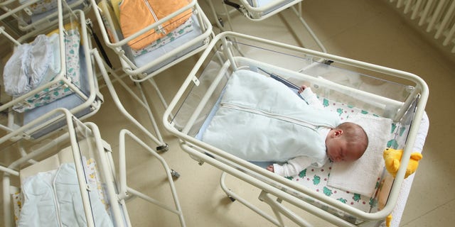 UNDISCLOSED, GERMANY - AUGUST 12: A 4-day-old newborn baby, who has been placed among empty baby beds by the photographer, lies in a baby bed in the maternity ward of a hospital (a spokesperson for the hospital asked that the hospital not be named) on August 12, 2011 in a city in the east German state of Brandenburg, Germany. According to data released by Eurostat last week Germany, with 8.3 births per 1,000 people, has the lowest birth rate in all of Europe. Eastern Germany, which not only suffers from a low birth rate, also has a declining population due to young people moving away because of high unemployment in the region. Europe as a whole suffers from a low birth rate and a growing elderly population. (Photo by Sean Gallup/Getty Images)
