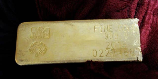 This undated photo provided by the FBI shows a gold bar that was recovered in Miami from a heist in North Carolina on March 1, 2015. Miguel Bover was sentenced to more than three years in prison in federal court in Miami, Tuesday Sept. 22, 2015, for his involvement in the attempted sale of a gold bar stolen in a $4.8 million North Carolina truck heist. The theft remains unsolved. (FBI via AP)