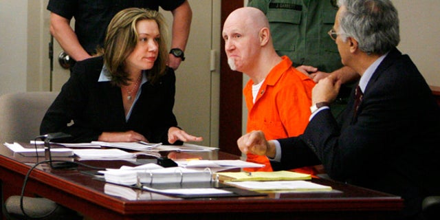 April 23: Convicted murderer Ronnie Gardner sits with his defense team at the Matheson Courthouse in Salt Lake City, Utah.