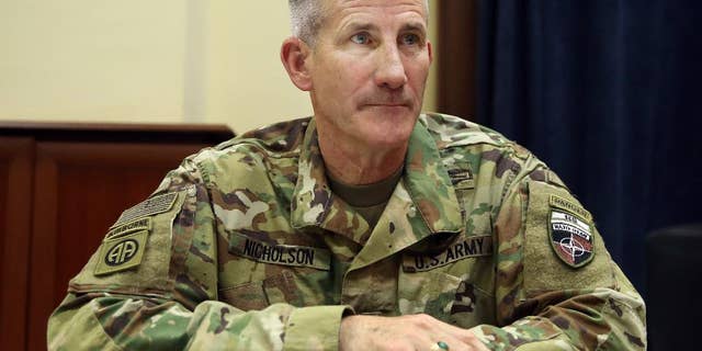 FILE - In this July 27, 2016 file photo, U.S. Army Gen. John Nicholson is interviewed by The Associated Press at his office in Kabul, Afghanistan. The Taliban have control over 10 percent of Afghanistan’s population and the insurgent group is battling with the Afghan government for control of at least another 20 percent, the top U.S. commander in Afghanistan said Friday, Sept. 23, 2016, describing a tough fight that is costing a high level of Afghan casualties. Nicholson said many of the Afghan deaths are in battles over checkpoints, where there are often a small number of forces who are poorly led, ill-equipped and not well trained. (AP Photo/Massoud Hossaini, File)