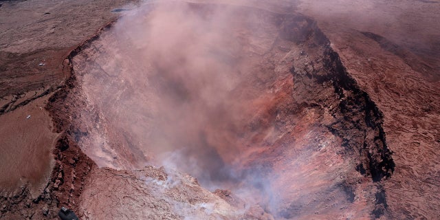 A plume of ash rises from the Puu Oo vent on Hawaii's Kilaueaa volcano.