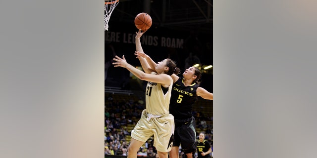 Colorado's Jasmine Sborov (21) shoots as Oregon's Jordan Loera defends during the second half of an NCAA college basketball game in Boulder, Colo., Sunday, Feb. 10, 2013. Colorado won 84-59. (AP Photo/Brennan Linsley)