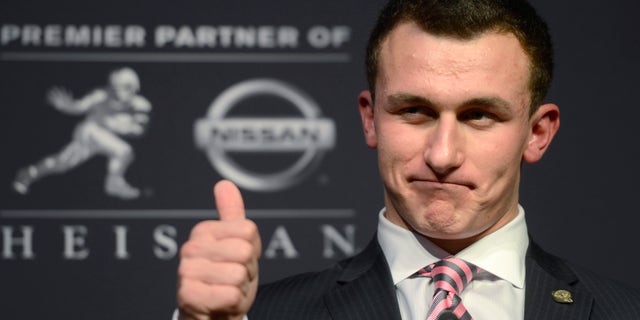 Dec. 8, 2012: Texas A&M quarterback Johnny Manziel talks to reporters after winning the Heisman Trophy.