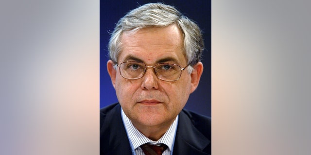 Lucas Papademos, former European Central Bank (ECB) Vice President attends a news conference about the results of the ECB-meeting in Berlin.