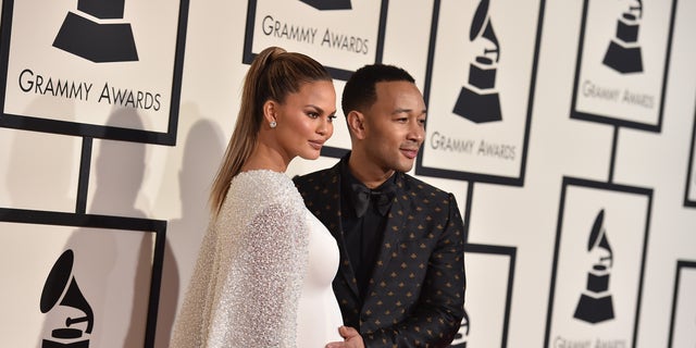 Chrissy Teigen, left, and John Legend arrive at the 58th annual Grammy Awards at the Staples Center on Monday, Feb. 15, 2016, in Los Angeles. (Photo by Jordan Strauss/Invision/AP)