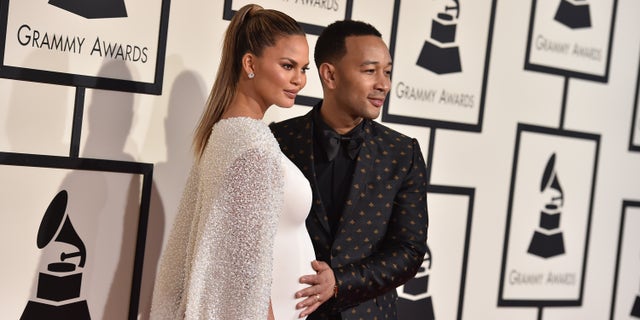 Chrissy Teigen, left, and John Legend arrive at the 58th annual Grammy Awards at the Staples Center on Monday, Feb. 15, 2016, in Los Angeles. (Photo by Jordan Strauss/Invision/AP)