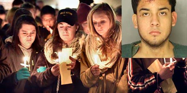 Millersville University students attend a candlelight vigil for slain student Karlie Hall in front of the Student Memorial Center, Monday, Feb. 9, 2015, in Millersville, Pa. Hall's boyfriend, Gregorio Orrostieta, was found guilty of third degree murder. (AP Photo/LNP, Suzette Wenger)