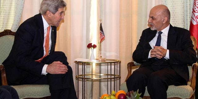 Secretary of State John Kerry talks with Afghanistan President Mohammad Ashraf Ghani during a bilateral meeting at the 51st Munich Security Conference (MSC) in Munich, Germany, Saturday, Feb. 7, 2015. The Ukraine conflict, Islamic State group jihadists and the wider "collapse of the global order" occupy the world's security community at the three-day annual meeting.  (AP Photo/Jim Watson, Pool)