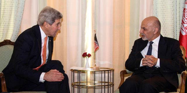 Secretary of State John Kerry talks with Afghanistan President Mohammad Ashraf Ghani during a bilateral meeting at the 51st Munich Security Conference (MSC) in Munich, Germany, Saturday, Feb. 7, 2015. The Ukraine conflict, Islamic State group jihadists and the wider "collapse of the global order" occupy the world's security community at the three-day annual meeting. (AP Photo/Jim Watson, Pool)